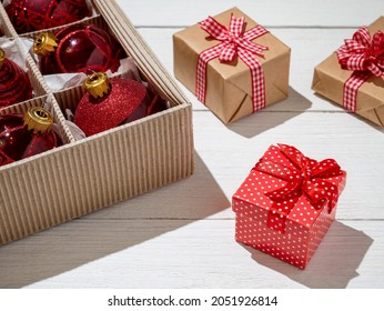 Christmas Box With Red Christmas Balls And Gifts, Christmas Trinkets.