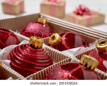 Christmas Box With Red Christmas Balls And Gifts, Christmas Trinkets.