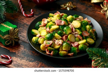 Christmas Brussel Sprouts And Bacon With Decoration, Gifts, Green Tree Branch On Wooden Rustic Table.