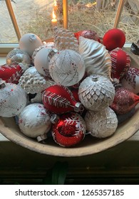 Christmas Bulbs In Old Wooden Bowl. Red And White Holiday Decorations. Old Fashioned Glass Bulbs Xmas Decor.