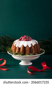 Christmas Bundt Cake Glazed And Decorated With Sugared Cranberries, Front View X-mas Food Concept With Copy Space For A Text