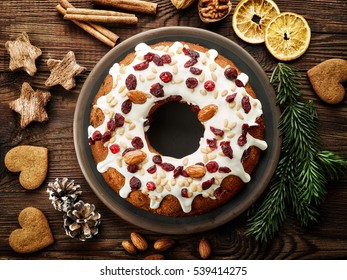 Christmas Cake With Fruits And Nuts On Wooden Table, Top View