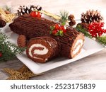 Christmas cake shaped like a log. Yule log or Buche de Noel