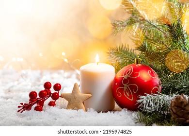 Christmas candle on snow-covered boards - decoration with natural elements, twigs, pine cones, Christmas decorations. Copy space. - Powered by Shutterstock