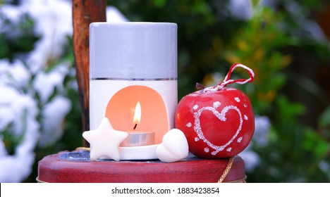 Christmas Candle Wax Melt Burner, Winter Advent Scene. Heart and Star Melt with Decorations. Festive December. Snow and Ornaments
 - Shutterstock ID 1883423854