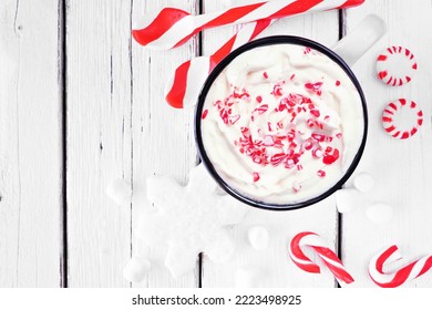 Christmas Candy Cane Hot Chocolate. Top Down Table Scene With Peppermints Against A White Wood Background.