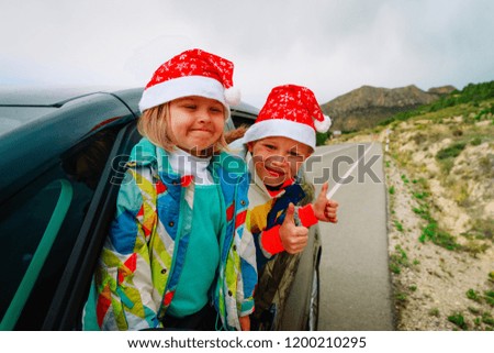 christmas car travel- happy kids travel in winter