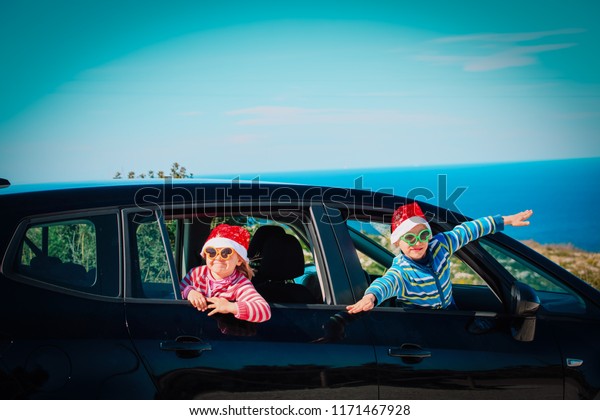 christmas car\
travel- happy kids travel in\
winter