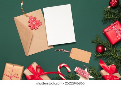 Christmas card, background. Paper gift boxes and an envelope with a blank card framed by coniferous branches. Copy space. Boxing Day concept, DIY gifts. - Powered by Shutterstock