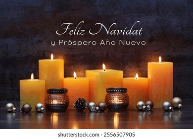 Christmas card: Candles with Christmas decorations. Spanish inscription translates as Merry Christmas and a Happy New Year. - Powered by Shutterstock