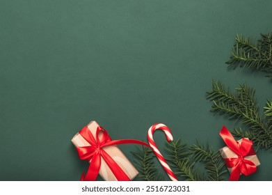 Christmas card, frame, background with pine branches and paper gift boxes and red Christmas candy cane. DIY gifts. - Powered by Shutterstock