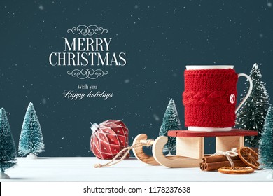 Christmas card with the inscription Merry Christmas. White mug with cocoa in red knitted clothes on Santa Claus sleigh dark background toy tree, red ball, cinnamon sticks a slice. Snowing. Front view - Powered by Shutterstock