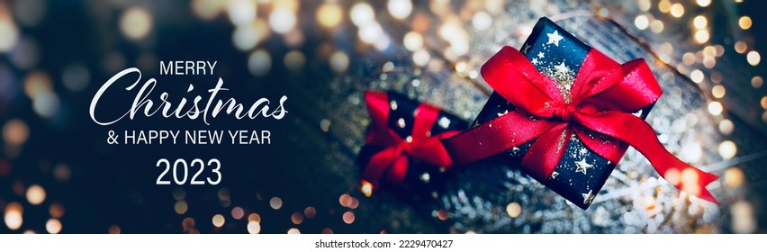 Christmas Card - Merry Christmas and Happy New Year 2023 - Beautiful gift box and golden bokeh lights - Shutterstock ID 2229470427