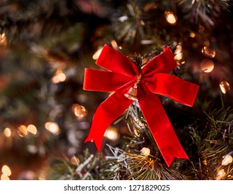 Christmas Card On Mantle With Red Ribbon And Lights.