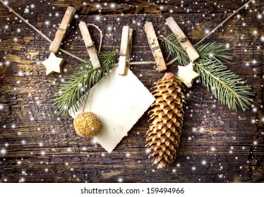 christmas card with stars,fir and  fir-cone on wooden background/ Christmas card with christmas natural decorations