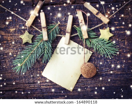 christmas card with stars,fir and fir-cone on wooden background/ Christmas card with christmas natural decorations