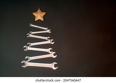 Christmas Card with tools for car in shape of Christmas Tree. Industrial greeting card. Happy New Year concept. Copy space