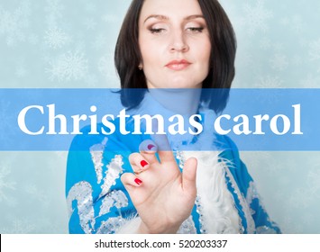 Christmas Carol Written On Virtual Screen. Concept Of Celebratory Technology In Internet And Networking. Woman In Christmas Uniform Presses Button On Virtual Screens.