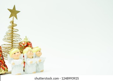 Christmas Caroling Or Carolers Singing.Angel Group Singing Carol Song On Celebration Of Christmas Day In Winter Time White Background.copy Space.