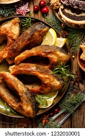 Christmas Carp, Fried Carp Fish Slices On A Ceramic Plate, Close Up, Top View. Traditional Christmas Eve Dish. Polish Christmas