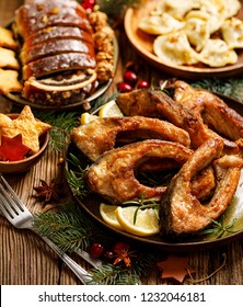 Christmas Carp, Fried Carp Fish Slices On A Ceramic Plate, Close Up, Top View. Traditional Christmas Eve Dish. Polish Christmas