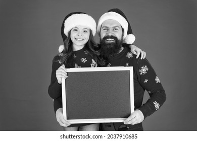 Christmas Celebration Schedule. Christmas Party Timing. Christmas Check List. Father Daughter With Blackboard Copy Space. Get Ready For Holiday. Santa Claus Family Look. Bearded Dad And Small Girl