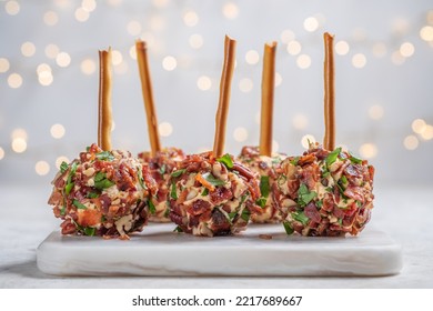Christmas cheese ball appetizers with bacon, pecans and herbs. - Shutterstock ID 2217689667