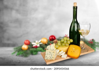 Christmas Cheese Platter With  Nuts, Figs On Kitchen Desk. Xmas Gourmet Holiday Appetizer.