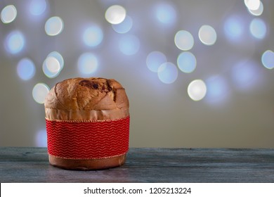 Christmas Chocolate Cake Panettone With A Red Strip In A Christmas Light Background Or Panetone Chocotone