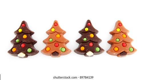 Christmas Chocolate Candy In Shape Of Tree Over White Background