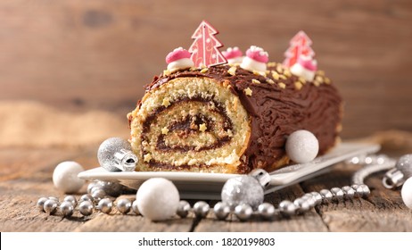christmas chocolate swiss roll and decoration- chocolate yule log christmas cake - Shutterstock ID 1820199803