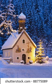 Christmas Church With Tree At Evening