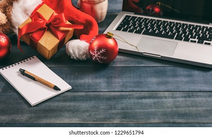 Christmas, closed office. Xmas decoration and a computer laptop on an office desk, copy space - Powered by Shutterstock