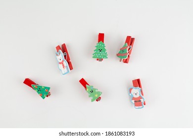 christmas clothespins on white with christmas tree - Powered by Shutterstock