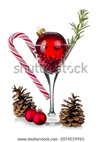 Christmas cocktail Ornamentini in martini glass on white background
