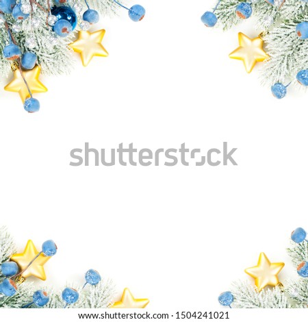 Christmas composition corner top view. Colorful winter background with green Xmas tree twig, blue decoration and gold stars isolated on white background