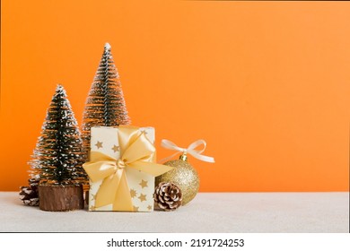 Christmas Composition. Craft Gift Box, Small Tree, Branches And Craft DIY Decorations On White Background. New Year Concept. Christmas Home Decoration Flat Lay, Top View, Copy Space.