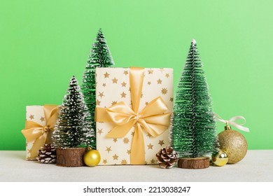 Christmas Composition. Craft Gift Box, Small Tree, Branches And Craft DIY Decorations On White Background. New Year Concept. Christmas Home Decoration Flat Lay, Top View, Copy Space.