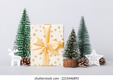 Christmas Composition. Craft Gift Box, Small Tree, Branches And Craft DIY Decorations On White Background. New Year Concept. Christmas Home Decoration Flat Lay, Top View, Copy Space.