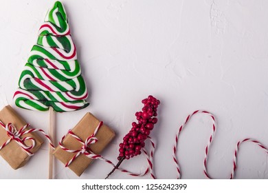 Christmas composition flat lay, red and green, presents, twine, christmas candy, flat lay