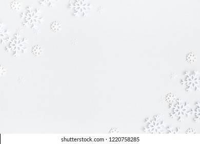 Christmas composition. Christmas frame made of snowflakes on pastel gray background. Winter concept. Flat lay, top view, copy space