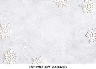 Christmas composition. Frame made of snowflakes on gray background. Christmas, winter, new year concept. Flat lay, top view - Shutterstock ID 2055812495