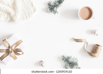 Christmas composition. Gift, fir tree branches, plaid, cup of coffee, balls on white background. Christmas, winter, new year concept. Flat lay, top view, copy space - Powered by Shutterstock