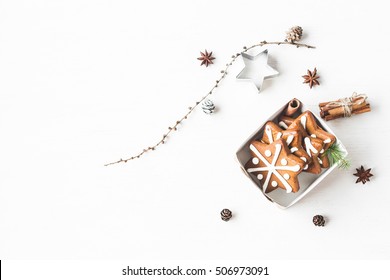 Christmas composition. Gift, larch branches, cinnamon sticks, anise star, christmas cookies. Flat lay, top view - Powered by Shutterstock