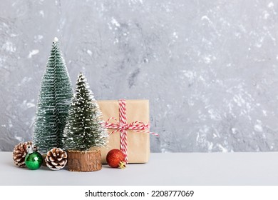 Christmas Composition. Gifts, Small Tree, Branches And Craft DIY Decorations On White Background. New Year Concept. Christmas Home Decoration Flat Lay, Top View, Copy Space.