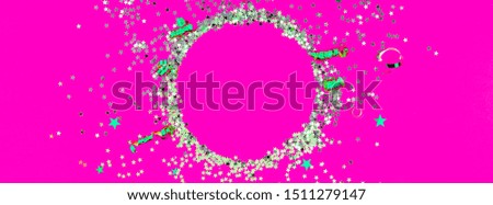 Christmas composition. New Year or Christmas pattern flat lay top view Xmas holiday celebration decorative silver round glitter frame on purple background with copy space. Template of greeting card