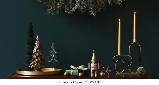 Christmas composition on brwon wooden commode with decoration, christmas tree, gifts and accessories in cozy home decor. Copy space. Template. - Powered by Shutterstock