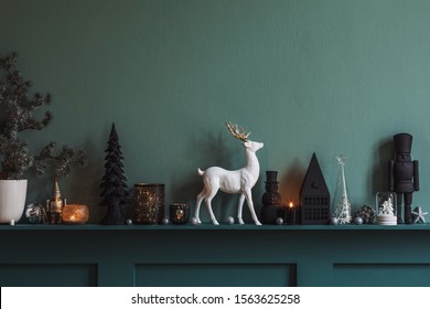 Christmas composition on the shelf in the living room interior. Beautiful decoration. Christmas trees, candles, stars, light and elegant accessories. Merry Christmas and Happy Holidays, Template. 
