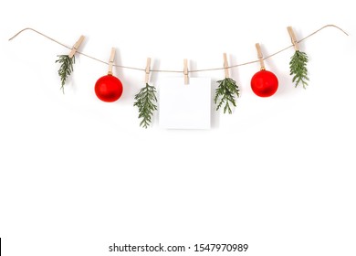 Christmas composition on a white background. Sisal string, fir twigs, Christmas balls, place for your advertisement or text. Wooden laundry clips. copy space, top view, flat photo. December day and Ch - Shutterstock ID 1547970989