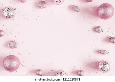 Christmas composition. Christmas pink decorations on pastel pink background. Flat lay, top view, copy space